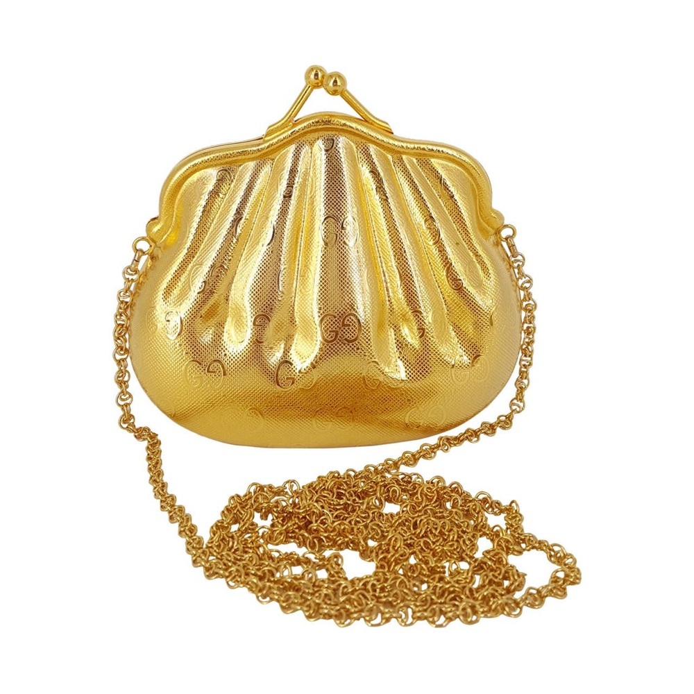 Looking to buy Gucci gold shell kisslock clutch